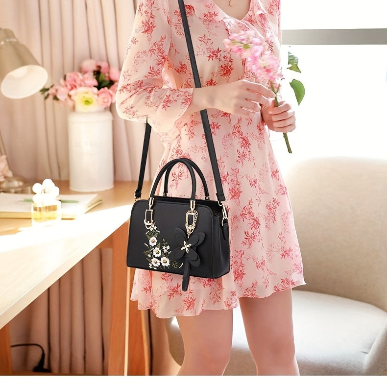 Dam handväska – Blommig broderad svart faux leather