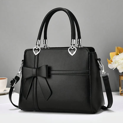 Chic damhandväska med rosett – axelrem & handledsväska