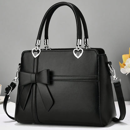 Chic damhandväska med rosett – axelrem & handledsväska