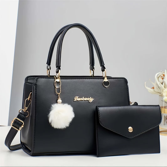 Elegant handväska i enfärg med pom-pom dekoration – multifack